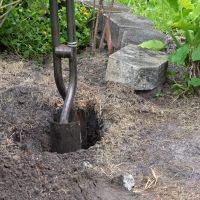 dig fence post holes to make removable fence post